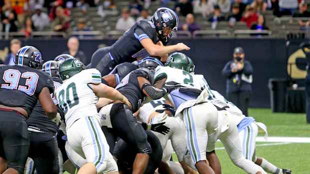 Zachary quarterback Eli Holstein (10) leaps in for a 1-yard score in the third quarter of the Class 5A State Championship game between Ponchatoula and Zachary at the Caesars Superdome on Saturday, December 11, 2021. (Michael DeMocker) Class5achamp07
